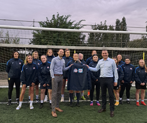 Directors Martyn Curran and Martyn Willimer present the new training jackets to the Yaxley Phoenix Ladies Football team