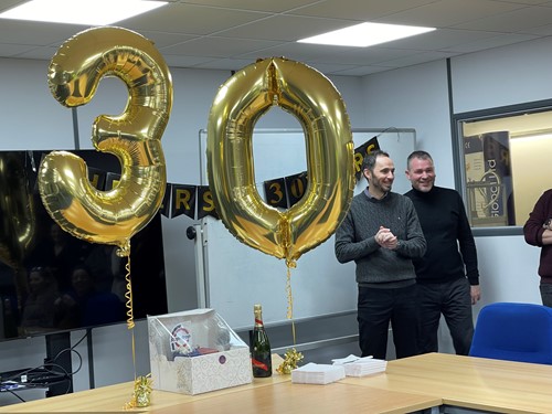 The company came together to present Martyn with a celebration for his 20 years of service